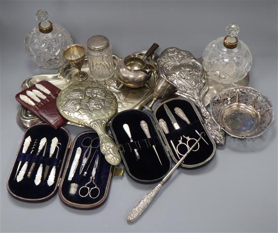 A silver hand mirror and a quantity of assorted plated wares.